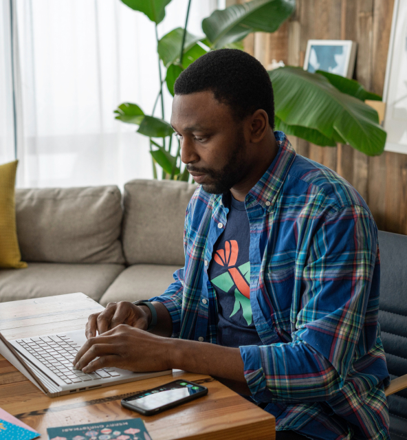 Image of a man using a laptop